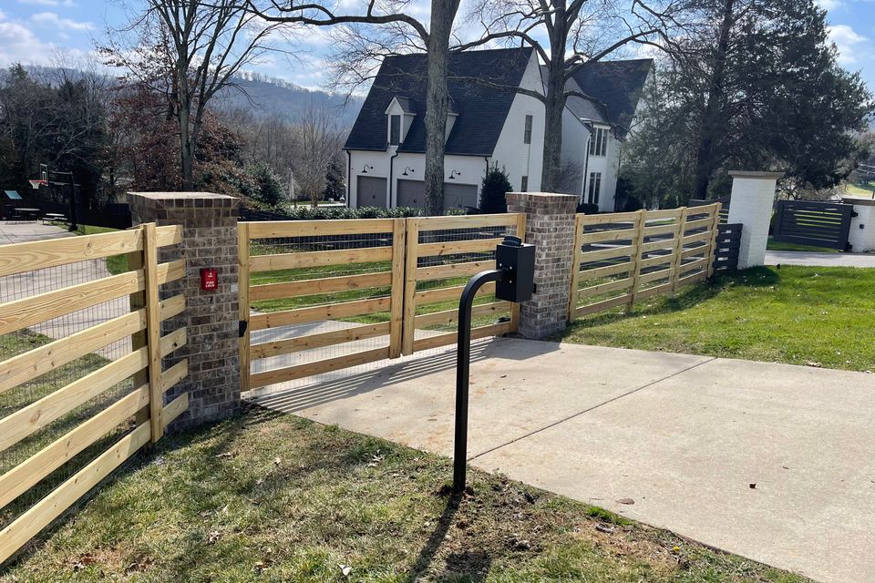 Jonathan Meadows setting a fence post on a Tennessee job site